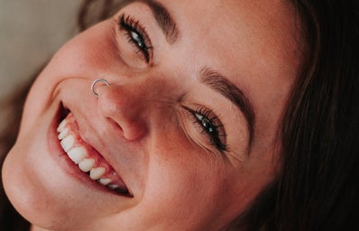 girl with nose piercing smiling