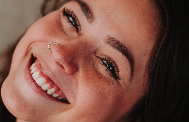 girl with nose piercing smiling