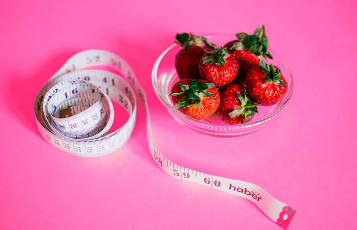 pink background strawberry bowl tape measure