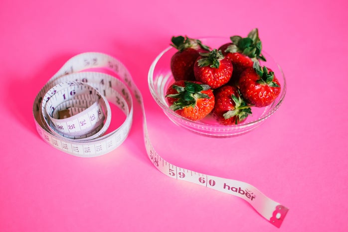 pink background strawberry bowl tape measure