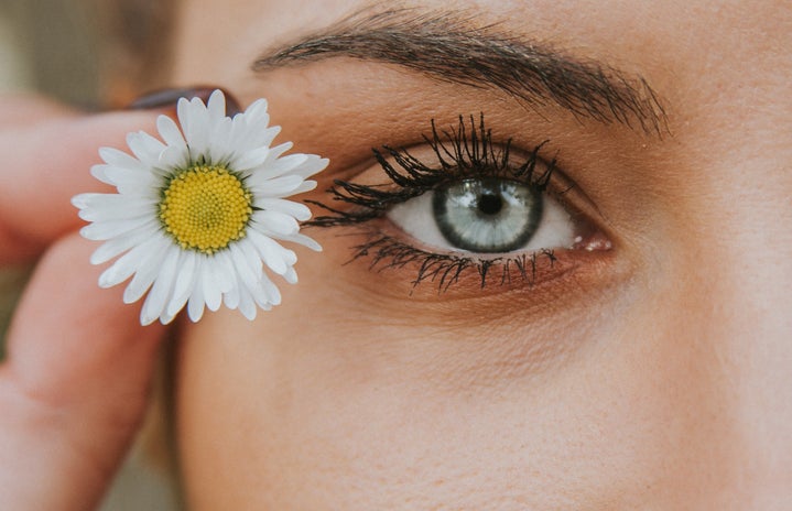 eye with a flower beside it