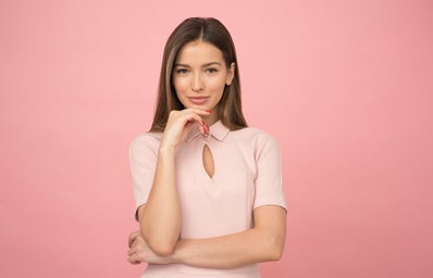 woman wearing pink collared half sleeved top business casual