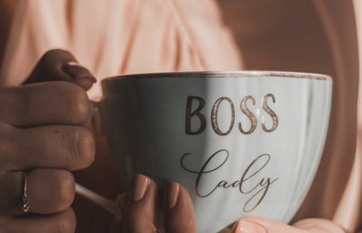 woman holding coffee cup saying boss lady