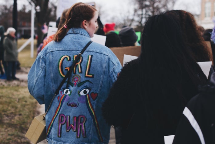 Woman wearing painted jean jacket