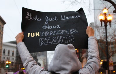 Feminist activist holding sign