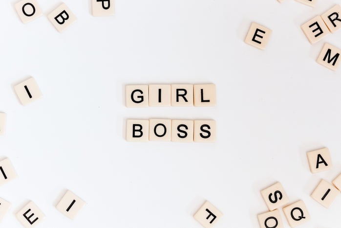 Letter tiles spelling "girl boss"