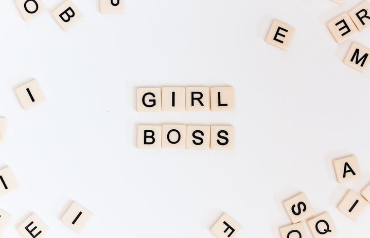 Letter tiles spelling "girl boss"
