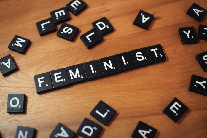 Scrabble tiles spelling "feminist"