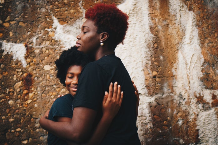 Mother holding her daughter