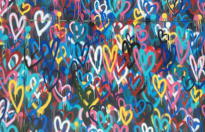 Colorful spray paint hearts wall