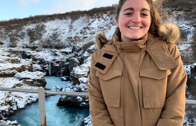 Zoe Dessoye in front of springs in Iceland.