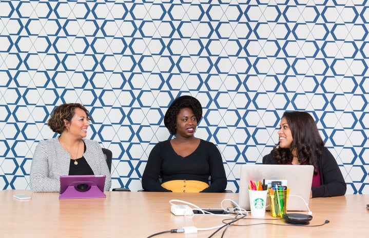 women talking in an office