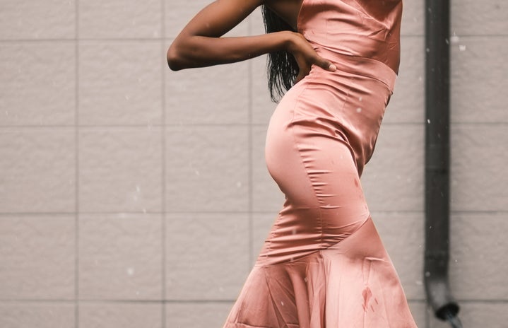 Woman wearing pink satin dress