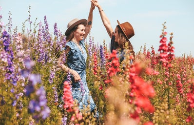 two girls in a field of flowers