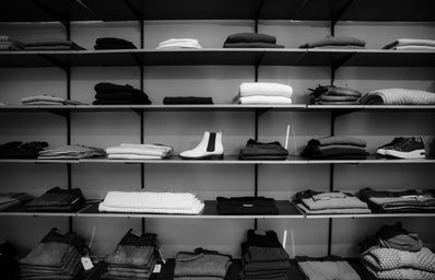 black and white clothes on shelves