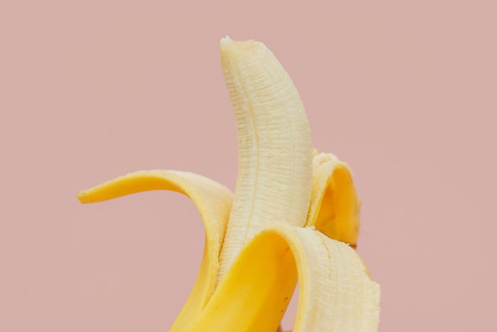 banana fruit peeled on pink background?width=698&height=466&fit=crop&auto=webp