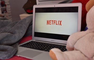 open laptop with the Netflix logo on it