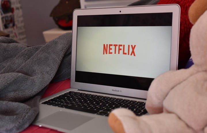 open laptop with the Netflix logo on it