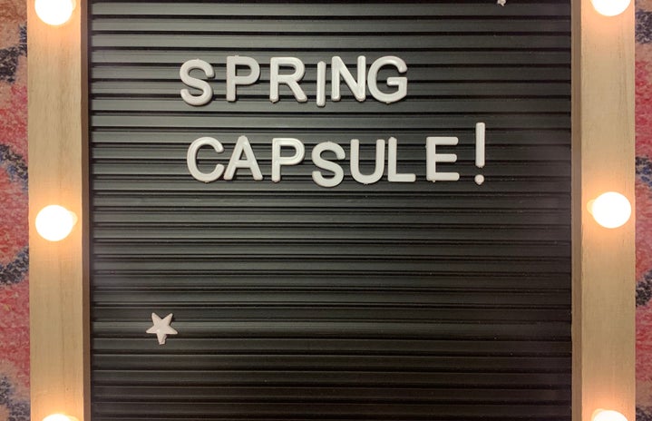 spring capsule sign on a rug