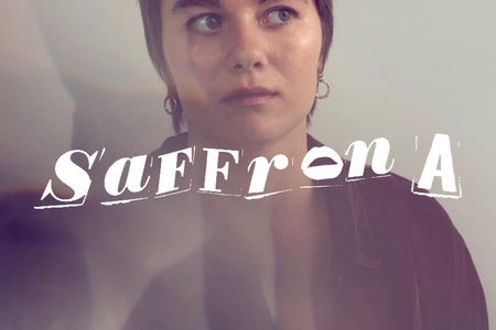 Woman portrait, she is looking away from camera and her name is added on top of the image.