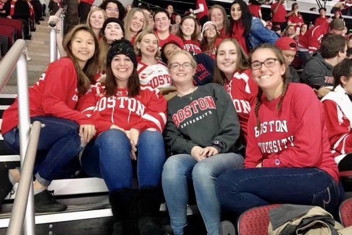 friends at a Boston University hockey game
