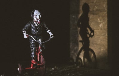 Jigsaw riding a bicycle