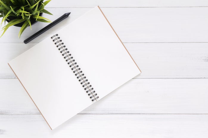 blank notebook with pencil