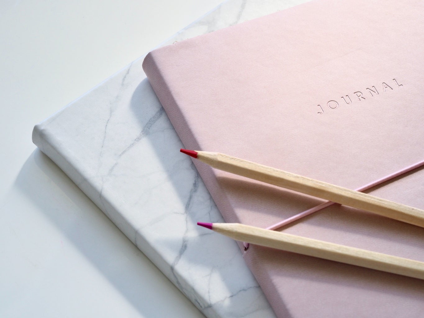 marble and pink notebook