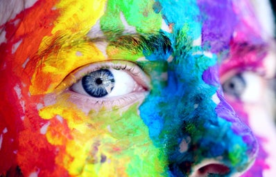 a face with colorful paint all over it