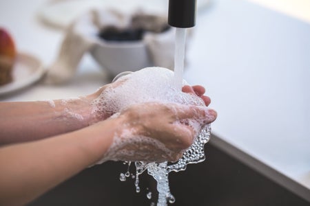person washing hands