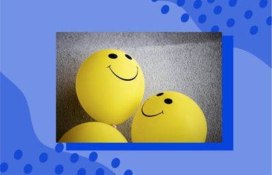 smiley face balloons on carpet