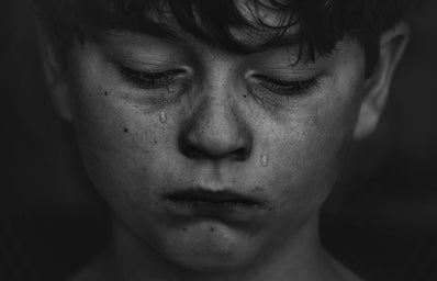 Boy cries in black and white