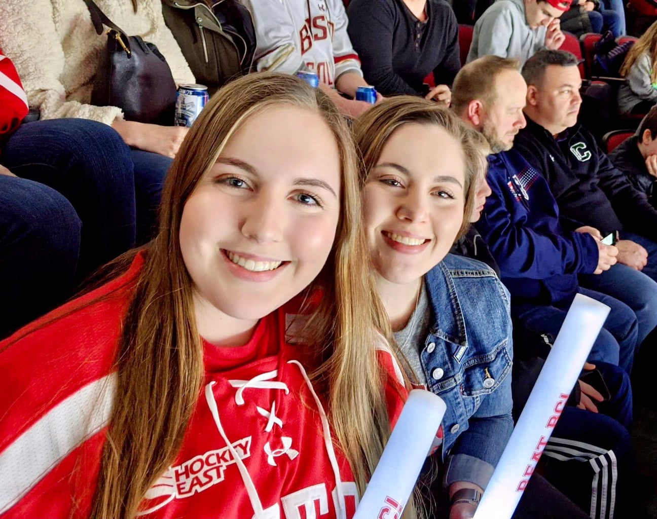 sisters at a Boston University hockey game