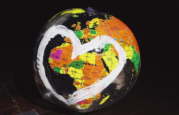 A globe with a heart drawn on it.