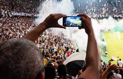 person taking photo of stage stadium presentation 2101030jpg?width=398&height=256&fit=crop&auto=webp