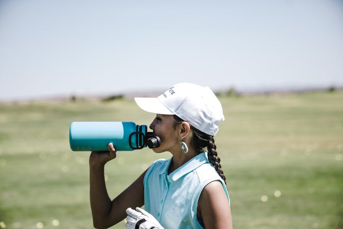 woman drinking at blue sports bottle outdoors 1325711jpg?width=698&height=466&fit=crop&auto=webp