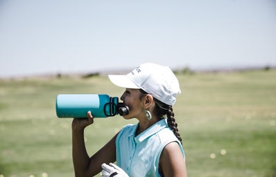 woman drinking at blue sports bottle outdoors 1325711jpg?width=398&height=256&fit=crop&auto=webp