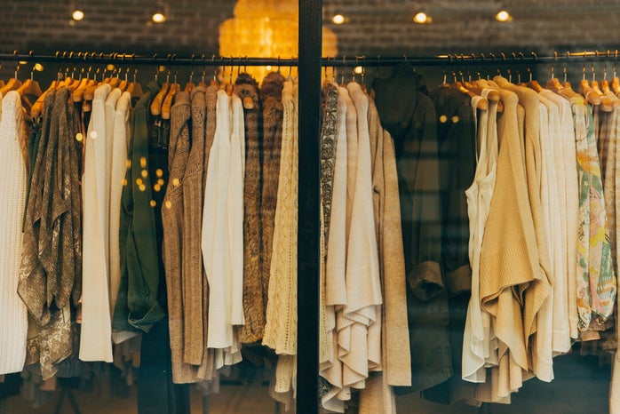 assorted tops hangin on a clothing rack