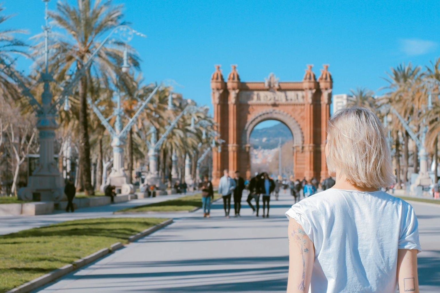 person standing at the Arco de Triunfo de Barcelona, Barcelona, Spain