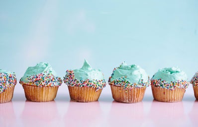 row of blue cupcakes