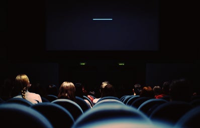 a movie theater with the projector on
