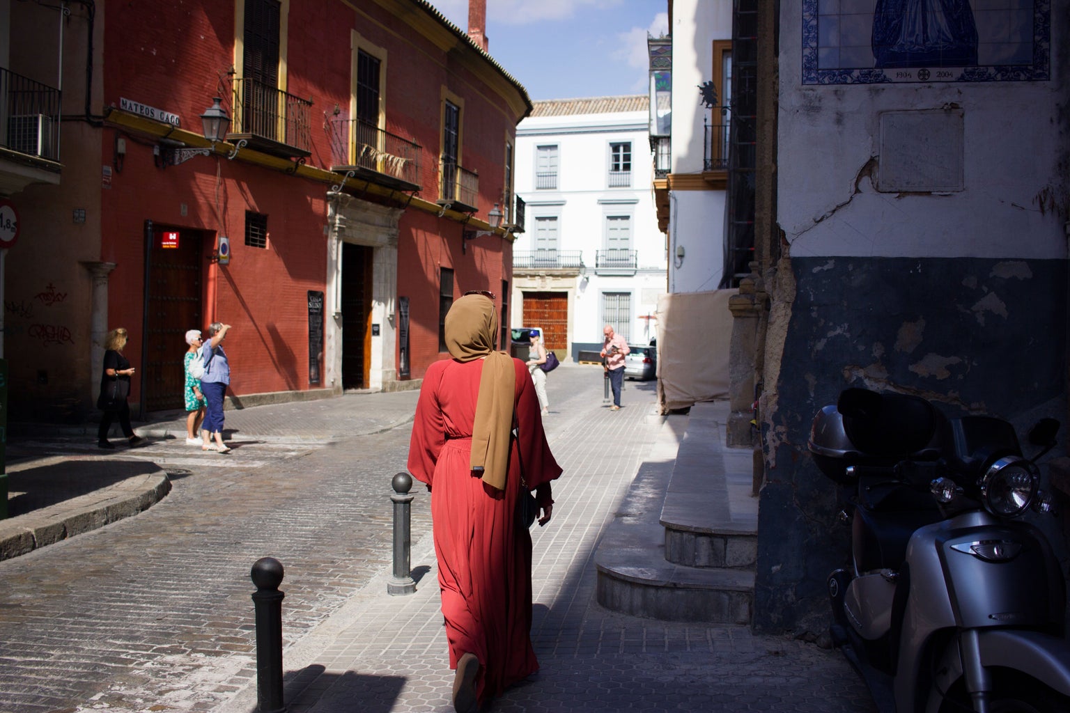 person walking through urban area of Seville, Spain