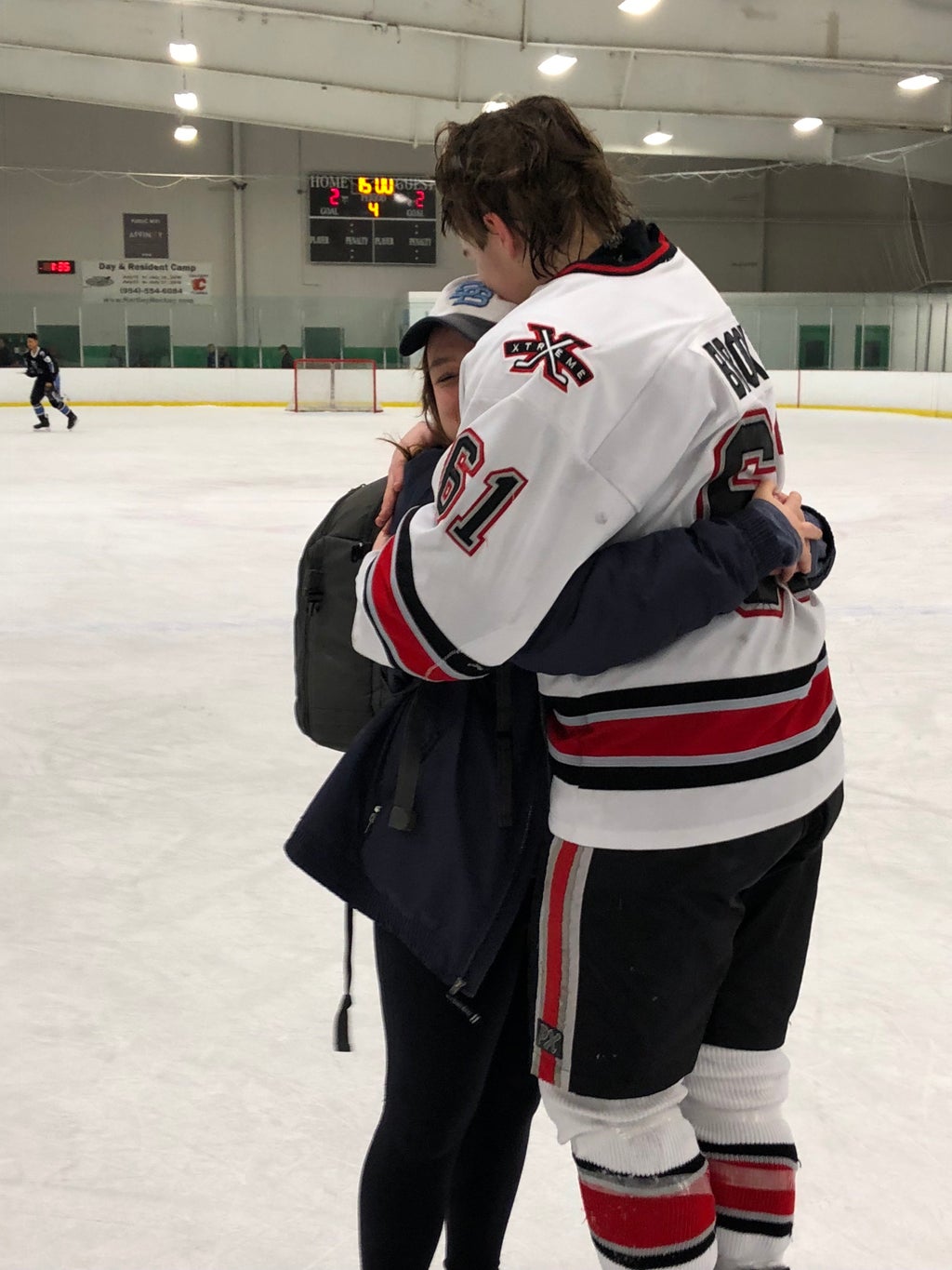 Hugging hockey player