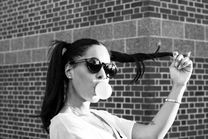 woman blowing bubble gum