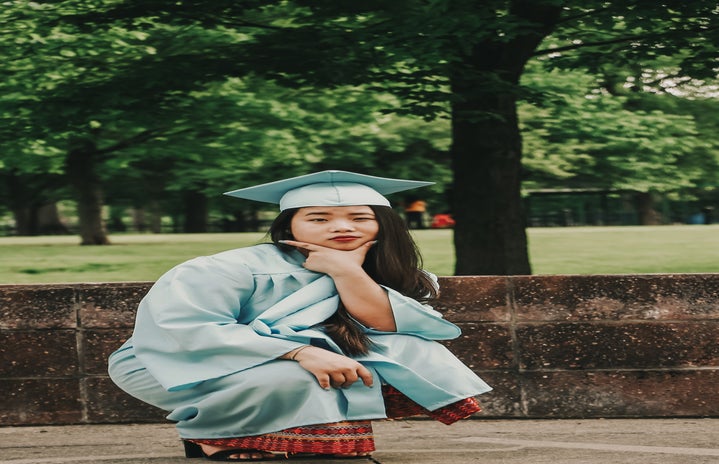 crouching woman wearing blue academic gown and hat 2335156?width=719&height=464&fit=crop&auto=webp