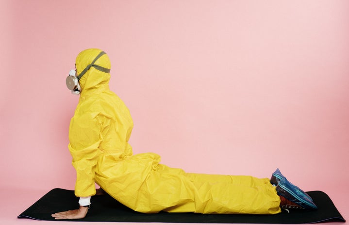 man in yellow suit stretching