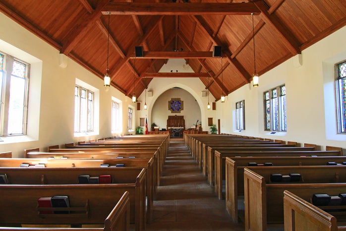 inside of church with wooden beams
