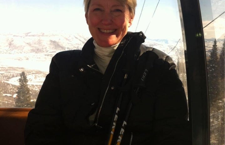 woman smiling on a ski lift