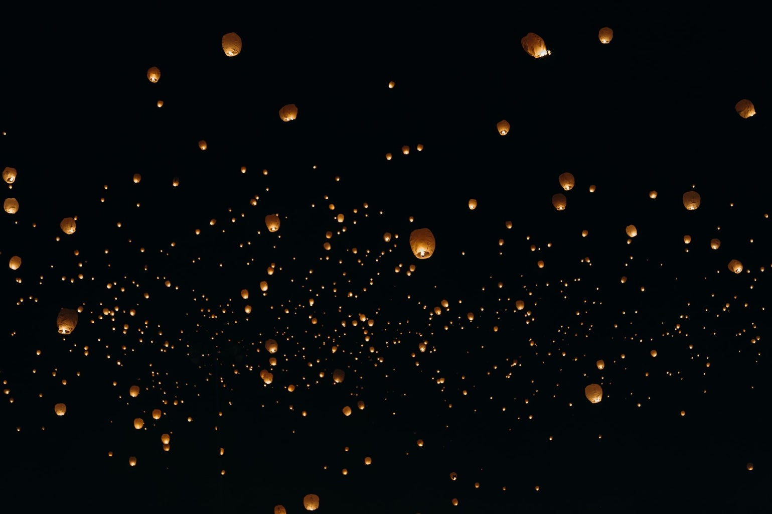paper lanterns in the night sky
