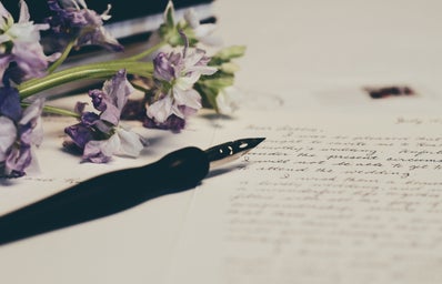 purple flowers on letter paper with fountain pen and handwriting